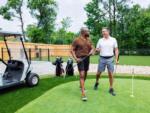 Two men playing golf at OCEANS RV RESORT - thumbnail