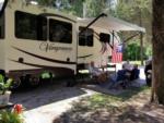 RVers relaxing at site at Country Dream RV Park - thumbnail