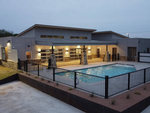 The pool at dusk at Ennis Luxury RV Resort - thumbnail