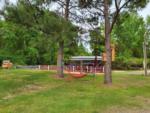 View of hammock outside of petting farm at HITCHINPOST RV PARK AND CAMPGROUND - thumbnail