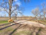 Paved sites with a picnic table and fire pit at RIVERSHIRE RV RESORT & CAMPING - thumbnail