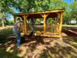 Two men working around the gazebo at RIVERSHIRE RV RESORT & CAMPING - thumbnail