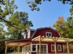 Barn surrounded by trees at Ozark Adventures RV Campgrounds - thumbnail