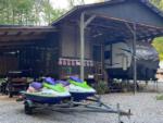 Covered RV port and jet skis at Barefoot Landing Camping Resort - thumbnail