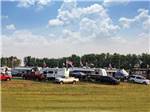 Aerial view of parked trailers in the grass at WORLD WIDE TECHNOLOGY RECEWAY CAMPGROUND - thumbnail