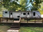 Trailer with wood deck at Cedar Lake Family Campground - thumbnail