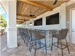 Outdoor bar seating at Southern Sands RV Resort - thumbnail