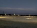 Open RV spaces with night time view at Inn and Out RV Park - thumbnail