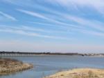 Lake with bridge in background at BRIDGEVIEW RV PARK - thumbnail