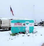 Camping trailer in the snow at Gracelyn RV Park - thumbnail