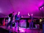 Three men playing music on a stage at PEACEFUL PINES FAMILY CAMPGROUND - thumbnail