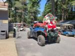 Santa Claus on the back of an ATV at PEACEFUL PINES FAMILY CAMPGROUND - thumbnail