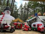 A RV site decorated with Christmas inflatables at PEACEFUL PINES FAMILY CAMPGROUND - thumbnail