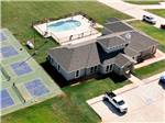 Aerial view of the office, pool and pickle ball courts at Crossroads Luxury RV Park - thumbnail