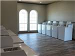 Washers and dryers in the laundry room at Crossroads Luxury RV Park - thumbnail