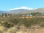 A view of the mountain with snow at MOUNTAIN MEADOWS RV PARK - thumbnail