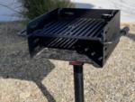 A barbeque pit at one of the sites at DESERT SPRINGS RV RESORT - thumbnail