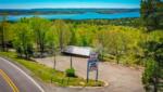 Sign and road leading into Blue Clouds RV & Cabins Resort - thumbnail