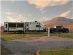 A travel trailer hitched to a truck - thumbnail