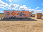 Trailer painted with flowers at Vinyl Vineyards - thumbnail