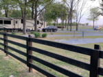 Fence in front of gravel sites at The Park on Whiskey Road - thumbnail