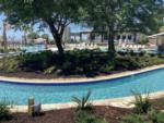 Lazy river with landscaping at GULFPORT LUXURY RV RESORT - thumbnail