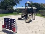 Playground with games at GULFPORT LUXURY RV RESORT - thumbnail