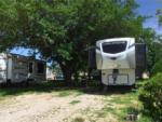 An Avalanche fifth wheel trailer parked in a site at BROKEN SPOKE RV - thumbnail