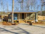 A soda vending machine in front of a green building at SANWAR RV PARK & RESORT - thumbnail