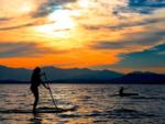 Paddle boarder at sunset at LAKE SHORE RV PARK - thumbnail