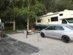 Silver car in camp spot at LAKE SHORE RV PARK - thumbnail