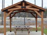 Picnic benches under a gazebo at CROOKED OAKS RV PARK - thumbnail