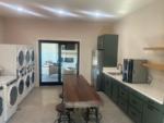 Large laundry room with kitchen area at WILLIS HILLSIDE RV RESORT - thumbnail