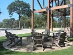 Adirondack chairs around a fire pit at WILLIS HILLSIDE RV RESORT - thumbnail