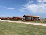 A row of cabin rentals at SILVER WIND RV PARK AND CABINS - thumbnail