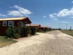 The gravel road that leads to the rental cabins at SILVER WIND RV PARK AND CABINS - thumbnail