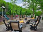 Chairs around fire pit at DUDLEY CREEK RV RESORT - thumbnail