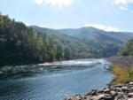 View of the river and mountains at SWEETWATER SIGHTS RV PARK & CABIN RENTALS - thumbnail