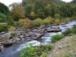 Creek with rocks at SWEETWATER SIGHTS RV PARK & CABIN RENTALS - thumbnail