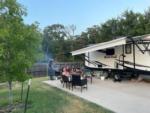 A family barbecuing at their site at TIMBER RIDGE RV PARK - thumbnail