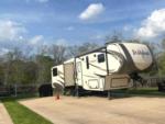 A fifth wheel parked in a RV site at TIMBER RIDGE RV PARK - thumbnail