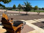 Adirondack chairs, fire pit and brewery in the distance at STARDUST AIRSTREAM RV RESORT AT CEDAR BREAK LODGING - thumbnail