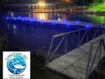 Dock with blue lights at night at LAKETIME RV CAMPGROUND - thumbnail