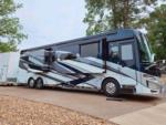 A motorhome parked in a extra, long hook up site at SMOKY MOUNTAIN PREMIUM CAMPING - thumbnail