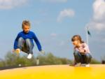 Kids on the bounce pillow at SANDUSKY RV RESORT - thumbnail