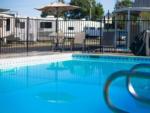 Pool area with table and chairs at ROSEDALE VILLAGE RV PARK - thumbnail