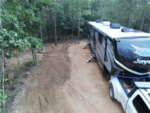 5th wheel in a dirt site at Harmony Ridge RV Park - thumbnail