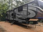 Parked trailer at site Harmony Ridge RV Park - thumbnail