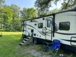 Trailer in grass site at Winona Lake Campground - thumbnail