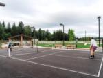 A couple playing pickle ball at ANGEL OF THE WINDS CASINO RESORT - thumbnail